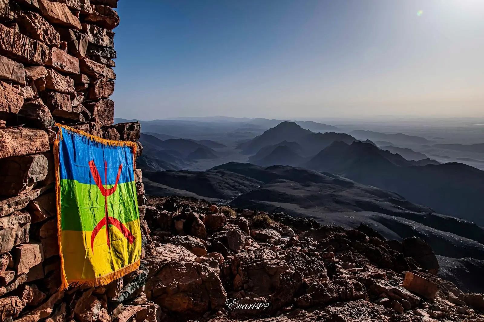 Berber Flag representing Amazigh culture in Morocco with Atlas Mountains landscape