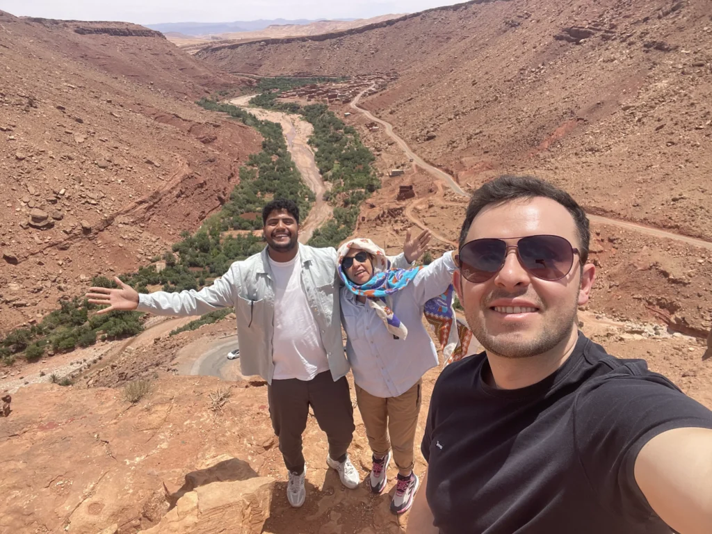 Marrakech to Merzouga desert tour through the Atlas Mountains with travelers enjoying the Morocco desert landscape